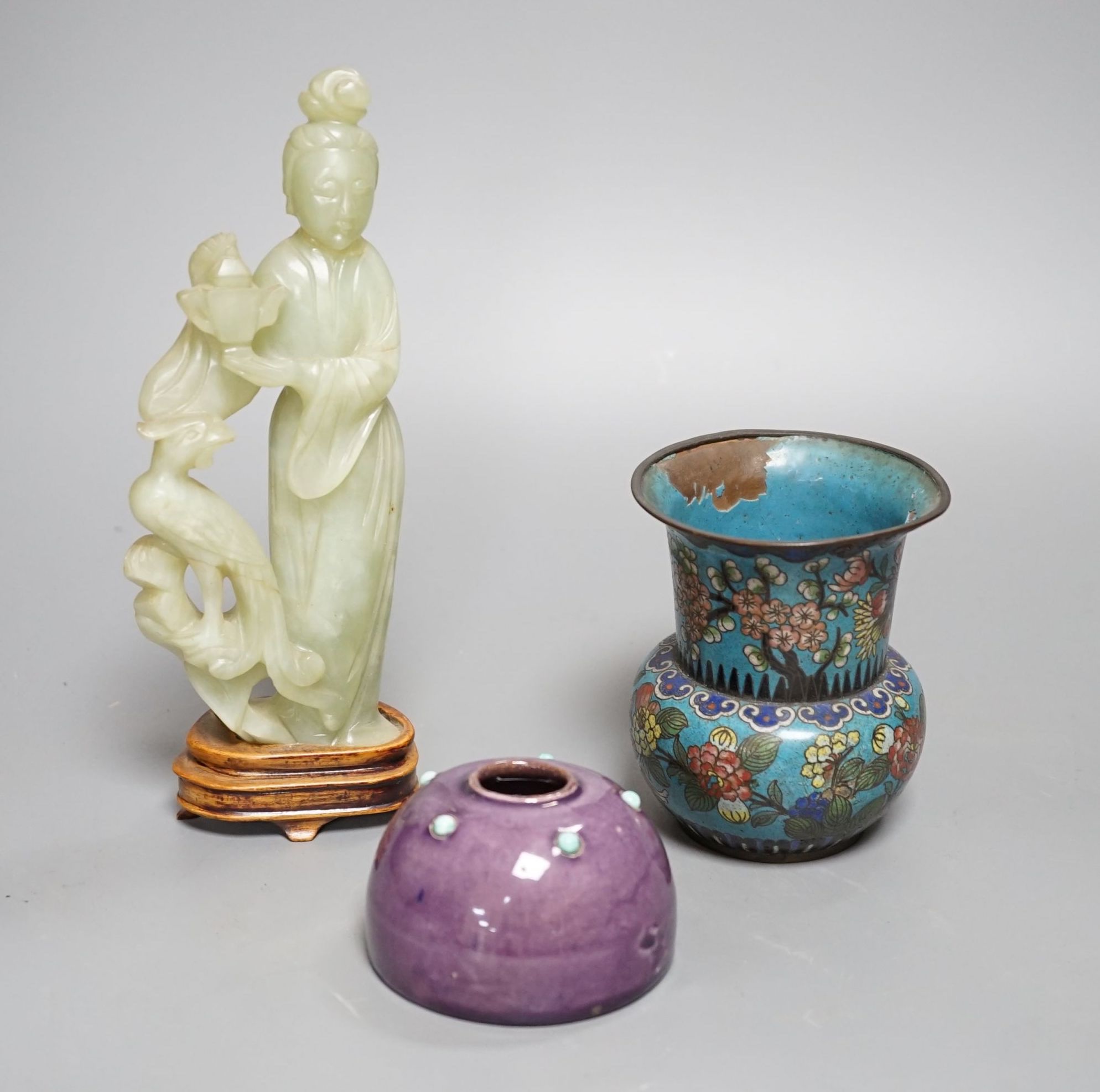 A small enamelled cloisonné vase, 10cm, together with a carved bowenite jade figure, on wood plinth and glazed ceramic brush pot